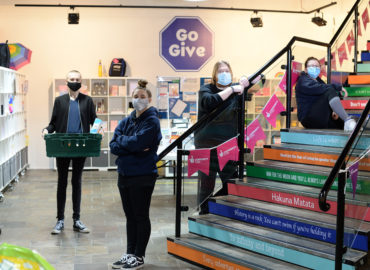Motivated minds volunteers wearing facemasks